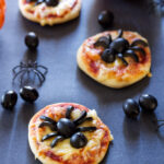 Mini Spider Pizzas | Recipe Runner | Spooky fun mini pizzas using delicious black olives! #CalOlivesHalloween #CleverGirls