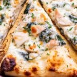 A slice of Chicken Alfredo Pizza