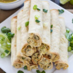 Baked Green Chile Chicken Taquitos | I love these lighter baked taquitos! They have the creamiest chicken filling! | www.reciperunner.com