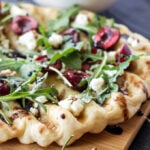 Grilled Cherry, Goat Cheese, and Arugula Pizza | Grilled pizza is perfect for summer and this cherry and goat cheese combination is delicious!