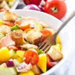 Salmon Panzanella Salad | Tomatoes, cucumbers, crusty bread, and grilled salmon make this panzanella the perfect summer salad!