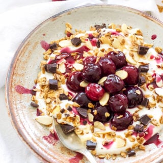 Roasted Cherry Yogurt Bowl with Granola | Sweet roasted cherries, crunchy granola and a little dark chocolate are the perfect toppings for this yogurt bowl!
