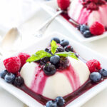 Vanilla Yogurt Panna Cotta with Warm Berry Sauce | All the creamy rich flavor that you expect from traditional panna cotta, but healthy enough to serve for breakfast!