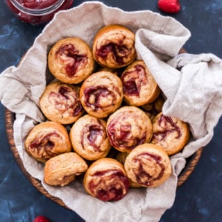 These Raspberry Jam Swirled Almond Butter Muffins are perfect for breakfast, brunch or an afternoon snack. 100% whole wheat, vegan and absolutely delicious, it's hard to only eat one!