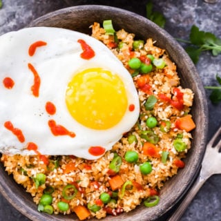 If you love fried rice, but want something a little better for you, then you have to try this Kimchi Cauliflower Fried Rice! Low carb, gluten-free and an extra kick of flavor from kimchi!