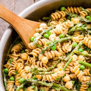One Pot Creamy Lemon Goat Cheese Pasta with Chickpeas and Asparagus is the perfect healthy, vegetarian, comfort food dinner for weeknights! Made with whole wheat pasta, fresh lemon and asparagus, chickpeas and creamy goat cheese to tie it all together.