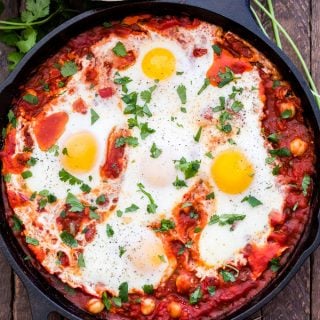 Moroccan Baked Eggs with Chickpeas is a simple, flavorful, vegetarian dish that can be on the table in less than 30 minutes! This versatile meal is hearty enough for breakfast or dinner.