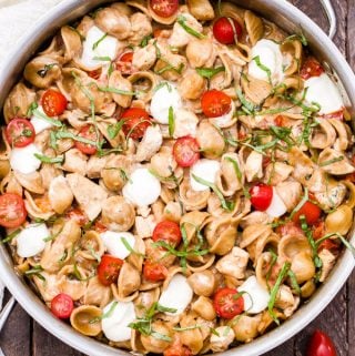 One Pot Caprese Chicken Pasta is perfect when you need a family-friendly dinner fast! Everything you love about a caprese salad turned into a main dish meal with the addition of whole wheat pasta and chicken breasts!