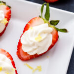 These Lemon Cheesecake Stuffed Strawberries are the perfect way to get your cheesecake fix without over doing it! They're super easy to make and great for parties too!