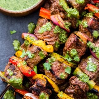 Steak Fajita Skewers with Cilantro Chimichurri are perfect for summer grilling! Big, juicy pieces of steak, sweet bell peppers and red onion all topped with an amazing cilantro chimichurri sauce. Healthy grilling never looked so good!