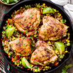 Skillet Chili Lime Chicken Thighs with Confetti Cauliflower Rice is an easy and flavorful one skillet dinner the whole family will love! Gluten-free, low in carbs and high in protein!