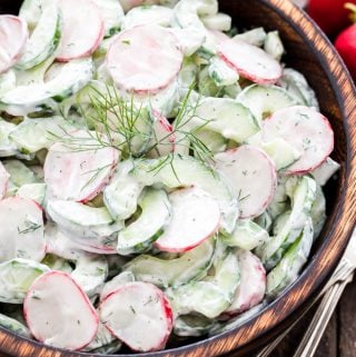 Cucumber Radish Salad with Creamy Yogurt Dill Dressing - Crisp and crunchy with a delicious creamy Greek yogurt dressing full of lemon juice and fresh dill. It's the perfect summer salad!