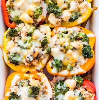 Traditional stuffed peppers get a makeover! These Cheesy Broccoli, Chicken and Rice Stuffed Peppers are loaded with flavor, kid-friendly and perfect for an easy and healthy comfort food dinner!