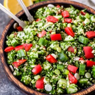 This Lebanese Tabbouleh Salad is loaded with fresh vegetables, bulgar wheat, parsley and mint. Toss everything together in fresh lemon juice and olive oil for the perfect, easy to make salad!
