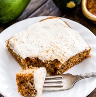 This easy to make Zucchini Spice Sheet Cake with cinnamon cream cheese frosting is perfect for making anytime of year. Whole wheat, sweetened with honey, loaded with warm spices and super moist! No one will suspect that it's been made with healthier ingredients!