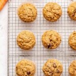 Cranberry Apple Carrot Muffins on a wire cooling rack.