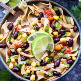 Classic chicken noodle soup gets a kick of Southwest flavor! Full of chicken, green chiles, black beans, corn and flavorful spices. You'll love this hearty and easy to make Slow Cooker Southwest Chicken Noodle Soup.