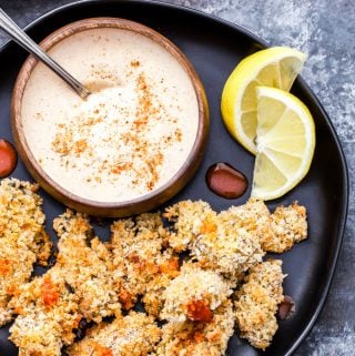 There's no deep-frying required to enjoy these crispy oysters! These Crispy Cajun Baked Oysters with Sweet and Spicy Dipping Sauce are the perfect appetizer for oyster lovers and adventurous eaters to enjoy at their next party! #oysters #Cajun #appetizer #newyearseve #baked #christmas