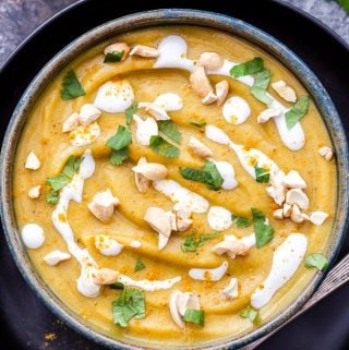 Thick, creamy, cozy, Curried Butternut Squash and Cauliflower Soup is as healthy as it is flavorful and delicious! Vegan, gluten-free, paleo and totally satisfying! #soup #paleo #vegan #glutenfree #butternutsquash #curry #cauliflower