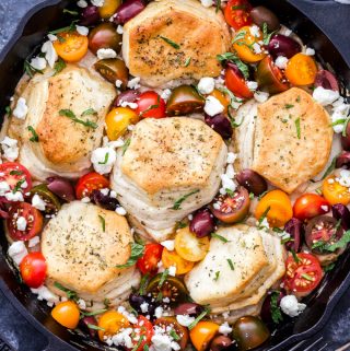 Biscuits and gravy get a delicious Greek flavored makeover and it's all made in one pot! One-Pot Greek Biscuits and Gravy Cobbler is perfect for your next brunch or whenever you need a cozy plate of comfort food! #biscuitsandgravy #brunch #breakfast #greek #sausage #feta #onepot
