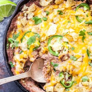 Cheesy Baked Jalapeño Black Bean Dip is the ultimate dip to serve for the big game or your next party! Cheesy, creamy and a little spicy, it will be gone before the game even starts! #appetizer #beandip #superbowl #glutenfree #vegetarian #easyrecipe #blackbeans #jalapeno