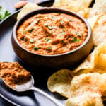This quick and easy Smoked Romesco Dip is perfect for game day or your next party! Almonds, roasted red peppers, garlic and plenty of smoked paprika make it a flavorful and highly addicting dip! #dip #appetizer #superbowl #romesco #roastedredpeppers #almonds #glutenfree #vegetarian