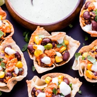 Barbecue Salmon, Black Bean and Corn Taco Cups are an easy, healthy and fun twist on taco night! Barbecue and Southwest flavors are combined together in these tasty 2-bite tacos! #salmon #tacos #blackbeans #appetizer #easyrecipe #easydinner #barbecue