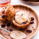 Cinnamon Raisin Sweet Potato Oatmeal Cups are perfectly portioned, freezer friendly and easy to make. Top them with almond butter for a healthy, quick and easy breakfast. #oatmeal #sweetpotato #cinnamonraisin #breakfast #glutenfree