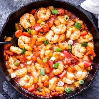 This healthier Sweet and Sour Shrimp Stir-Fry has all the flavor of your favorite restaurant version without all the calories and loads of sugar! Gluten-free and on the table in 30 minutes or less! #stirfry #sweetandsour #shrimp #healthy #glutenfree
