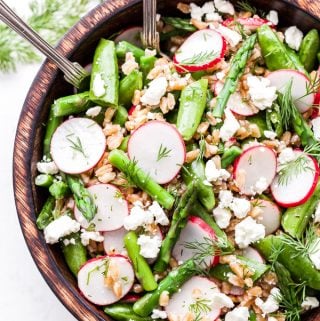 Asparagus Farro Feta Salad is a light and healthy salad to serve this spring! Full of spring's finest produce and tossed together with a tangy lemon vinaigrette. It's perfect as a side dish or add chicken or chickpeas and turn it into a main dish salad! #salad #asparagus #farro #springrecipe #vegetarian