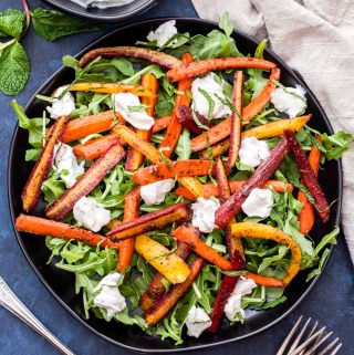 Five-Spice Roasted Carrot Salad with Mint Tahini Yogurt Sauce is full of warm, sweet, earthy flavors. Who knew these simple ingredients could taste so amazing together! #carrots #salad #glutenfree
