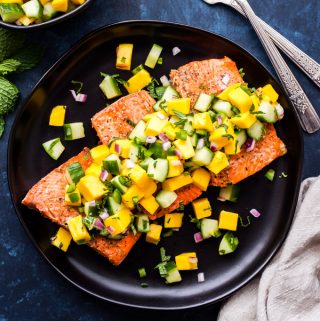 Grilled Salmon with Mango Cucumber Mint Salsa is a must make this grilling season! A fast, fresh, healthy and flavorful dinner you'll be making all summer long. #salmon #grilling #mango #salsa #paleo #glutenfree