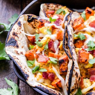 Sweet Potato, Bacon and Egg Breakfast Tacos are a dream come true for taco lovers! A super satisfying and delicious breakfast! #breakfasttacos #bacon #sweetpotato #egg #tacos #breakfast