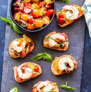 Shrimp Scampi Tomato Basil Bruschetta is a great way to turn classic bruschetta into something even more delicious! Super easy to make and perfect for an appetizer or even a main dish. #shrimp #bruschetta #shrimpscampi #appetizer
