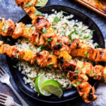 Sweet and Spicy Grilled Chicken and Pineapple Skewers will be your go-to dinner all summer long! Flavored with chili garlic sauce and sweetened with honey, these paleo and gluten-free chicken skewers are perfect for a protein packed, healthy dinner! #chicken #pineapple #skewers #paleo #glutenfree #healthydinner #grilledchicken