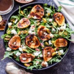 Grilled Fig, Goat Cheese and Pistachio Salad is a delicious and seasonal salad to make this summer! Sweet and slightly smoky grilled figs, tangy goat cheese, pistachios and a maple balsamic vinaigrette all top this flavorful salad. #figs #salad #goatcheese #pistachio