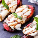 Caprese Balsamic Grilled Chicken is an easy and healthy dinner that's perfect for those sweet summer tomatoes! Balsamic marinated chicken breasts, thick slices of tomatoes, basil and fresh mozzarella.