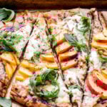 Chicken Peach Ricotta Pizza with Arugula and Balsamic Glaze is bursting with summer flavor! The perfect combination of savory and sweet that's not only great for dinner, but a tasty appetizer as well! #pizza #ricotta #chicken #peaches #dinner #appetizer