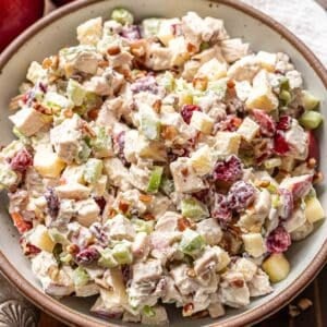 Harvest chicken salad in a white serving bowl.