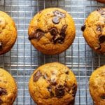 Pumpkin Chocolate Chip Muffins on a wire cooling rack.