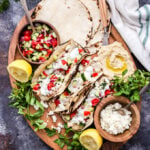 If you love Greek food and tacos you won't be able to resist these Greek Chicken Tacos with Tzatziki and Hummus! Fresh, healthy and loaded with all your favorite Greek flavors! #tacos #chicken #Greekchicken #Greekfood #dinner #glutenfree #healthyrecipes #tzatziki #hummus
