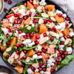 This Winter Quinoa Kale Salad is full of winter produce, hearty quinoa and peppery baby kale! It's a great alternative to your typical lettuce salad. #quinoa #salad #kale #winter #glutenfree #vegetarian