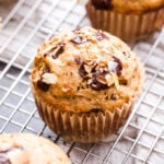 Coconut Chocolate Chunk Banana Muffins are wonderful for a weekend breakfast or brunch! These tender banana muffins studded with just the right amount of toasted coconut and dark chocolate chunks will go perfect with your cup of coffee. #muffins #bananamuffins #banana #chocolate #coconut #breakfast #brunch