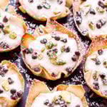 Pistachio Chocolate Chip Cannoli Cups are the easiest way to get your cannoli fix without all the work! Made with lighter ingredients and baked instead of fried, they're perfect for parties or any special occasion. #cannoli #ricotta #dessert #valentinesday #partyfood #chocolatechips #pistachio