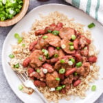 Slow Cooker Red Beans and Rice is one of the most comforting, affordable and easy to make meals! Perfect for Mari Gras or anytime you're craving spicy, hearty Cajun food! #redbeansandrice #slowcooker #marigras #cajunfood #dinner #glutenfree #kidneybeans