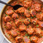 Skillet Chicken Tikka Masala Meatballs are a fun twist on the popular Indian dish. Chicken meatballs are simmered in a creamy and flavorful tikka masala sauce and served over rice for a cozy, ethnic meal. #tikkamasala #meatballs #chickenrecipe #chickentikkamasal #indianfood #skillet #dinner #glutenfree #dairyfree