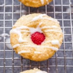 These mini Lemon Glazed Raspberry Muffins are perfect for spring brunch! Lemon flavored muffins topped with a fresh raspberry and drizzled with a sweet lemon glaze, you won't be able to eat just one! #muffins #raspberry #lemon #breakfast #brunch #minimuffin #Easter #MothersDay