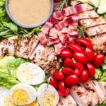 Grilled Rosemary Chicken Salad with Honey Mustard Dressing in small grey bowl