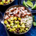 Jerk Chicken Bowls with Pineapple Black Bean Salsa in brown bowl