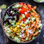 Barbecue Chicken Quinoa Bowls topped with black beans, tomatoes, corn and avocado crema.